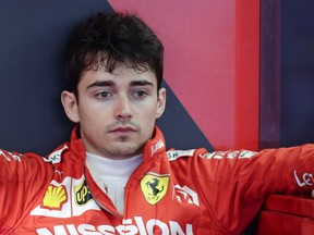 Ferrari driver Charles Leclerc of Monaco sits in the garage during the third free practice at the Barcelona Catalunya racetrack in Montmelo, just outside Barcelona, Spain, Saturday, May 11, 2019. The Formula One race will take place on Sunday.