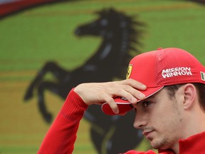 Ferrari driver Charles Leclerc of Monaco gestures during an autographs session at the Monaco racetrack, in Monaco, Friday, May 24, 2019. The Formula one race will be held on Sunday.