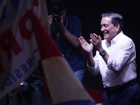 Presidential candidate Laurentino Cortizo, with the Democratic Revolutionary Party, applauds his supporters in Panama City, Monday, May 6, 2019. Cortizo, a 66-year-old cattleman, holds on to a narrow lead Sunday night as returns came in from Panama's presidential election, which followed a campaign that focused on corruption and slowing economic growth in this Central America trade and financial hub.