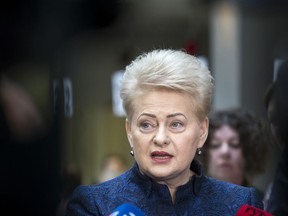 In this photo taken on Tuesday, May 7, 2019, Lithuania's President Dalia Grybauskaite speaks to the members of press at a polling station during the advance presidential elections in Vilnius, Lithuania. Dalia Grybauskaite became the first woman to hold the job and could easily be re-elected but the Constitution of the small Baltic country only allows a president whose powers include key role in foreign politics and national legislature to sit for a maximum of two consecutive terms of five years. Lithuanians will head to the polls on Sunday, May 12, in a first round of presidential elections.