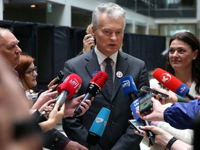 Business-minded economist Gitanas Nauseda, a presidential candidate, speaks to the members of press at a polling station during the advance presidential elections in Vilnius, Lithuania, Friday, May 10, 2019. Lithuanians will head to the polls on Sunday, May 12, in a first round of presidential elections.