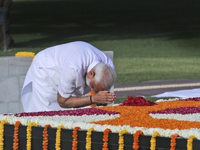 Indian Prime Minister Narendra Modi pays tribute at Rajghat, the memorial to Mahatma Gandhi, before being sworn in for his second term as Indian prime minister this evening in New Delhi, India, Thursday, May 30, 2019. India's president on Saturday appointed Modi as the prime minister soon after newly-elected lawmakers from the ruling alliance, led by the Hindu nationalist Bharatiya Janata Party, elected him as their leader after a thunderous victory in national elections.