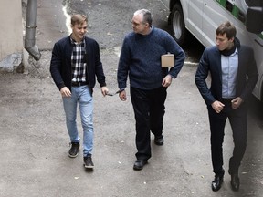 Paul Whelan, a former U.S. Marine, who was arrested in Moscow at the end of last year, is escorted for a hearing in a court in Moscow, Russia, Friday, May 24, 2019. The American was detained at the end of December for alleged spying.