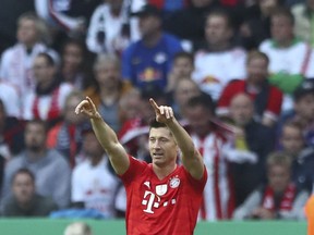 Bayern's Robert Lewandowski celebrates his goal against RB Leipzig during the German soccer cup, DFB Pokal, final match between RB Leipzig and Bayern Munich at the Olympic stadium in Berlin, Germany, Saturday, May 25, 2019.