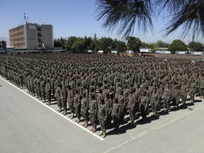 Afghan National Army soldiers attend their graduation ceremony from a 3-month training program at the Afghan Military Academy in Kabul, Afghanistan, Monday, May 27, 2019.