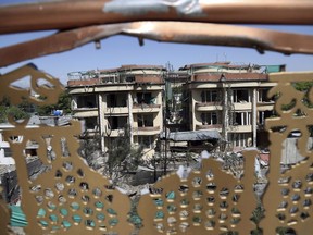 Buildings damaged by Wednesday's attack are seen in Kabul, Afghanistan, Thursday, May 9, 2019. Taliban fighters attacked the offices of a U.S.-based aid organization in the Afghan capital on Wednesday, setting off a huge explosion and battling security forces in an assault, the Interior Ministry said.