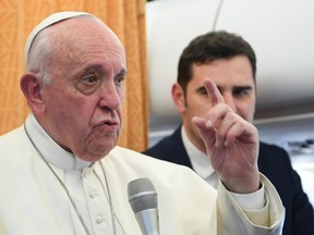 Pope Francis talks to reporters on his flight back to Rome, Tuesday, May 7, 2019. Francis made the first-ever papal visit to North Macedonia on Tuesday and sought to encourage its efforts to integrate into European institutions after its name change resolved a decades-long dispute with Greece. (Maurizio Brambatti/Pool Photo via AP)