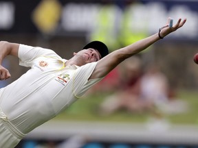 FILE - In this Feb. 4, 2019, file photo Australia's Jhye Richardson reaches to attempt a catch on Sri Lanka's Kamindu Mendis on day 4 of their cricket test match in Canberra. Richardson has been ruled out of the Cricket World Cup after failing to recover from a shoulder injury in time to be ready for Australia's opening game on June 1.