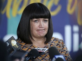 Rugby Australia Chief Executive, Raelene Castle announces that Rugby Australia has terminated star fullback Israel Folau's contract in Sydney, Australia, Friday, May 17, 2019. Rugby Australia terminated Folau's contract after he was found guilty of a high-level breach of the players' code of conduct for a social media post that condemned gay people and other "sinners" to eternal damnation.