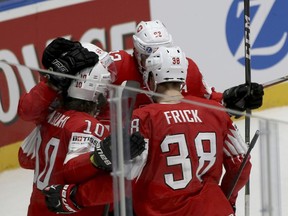 Swiss players react after scoring during the Ice Hockey World Championships group B match between Switzerland and Norway at the Ondrej Nepela Arena in Bratislava, Slovakia, Wednesday, May 15, 2019.