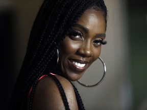 In this photo taken on Thursday, May 2, 2019, Nigerian singer-songwriter Tiwa Savage, poses for a photo, prior to an interview with The Associated Press in Lagos, Nigeria. Savage says there's a "revolution going on" in African music and she is "very humbled and excited" to take her music to a worldwide audience. "It's a beautiful journey, it's history in the making," Savage says of her newly announced recording deal. She is one of the world's leading Afrobeats artists and the first African artist to sign a global deal with Universal Music Group.