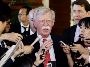 FILE - In this Friday, May 24, 2019, file photo, U.S. National Security Adviser John Bolton is surrounded by reporters at the prime minister's official residence in Tokyo, Japan. North Korea on Monday, May 27, 2019, has called U.S. National Security Adviser Bolton a "war monger" and "defective human product" after he called the North's recent tests of short-range missile a violation of U.N. Security Council resolutions.