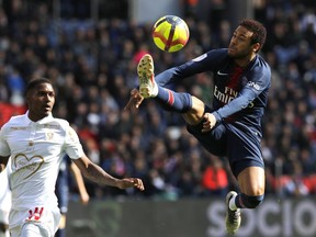 PSG's Neymar, right, controls the ball during the French League One soccer match between Paris Saint-Germain and Nice at the Parc des Princes stadium in Paris, France, Saturday, May 4, 2019.