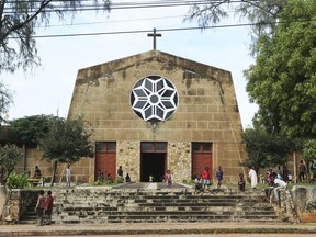 Children play outside a Roman Catholic Church in Pemba city on the northeastern coast of Mozambique in this Monday, April, 29, 2019 photo. Situated in the heart of an ethnically diverse city ravaged by Cyclone Kenneth, the Maria Auxiladora parish is housing close to 1000 people displaced by the storm which according to aid agencies has affected Cabo Delgado the countrys northern province.
