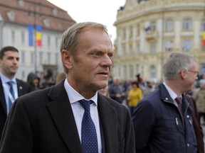European Council President Donald Tusk walks in Piata Mare square in the Transylvanian town of Sibiu, Romania, Wednesday, May 8, 2019. European Union leaders hold an EU summit in Sibiu on Thursday to start setting out a course for increased political cooperation in the wake of the impending departure of the United Kingdom from the bloc.