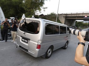 A car, which is believed to be carrying Vietnamese Doan Thi Huong, leaves a prison in Kajang, Malaysia, Friday, May 3, 2019.  A Vietnamese embassy translator says the Vietnamese woman who was tried for the killing of the estranged half brother of North Korea's leader has been released from a Malaysian prison.