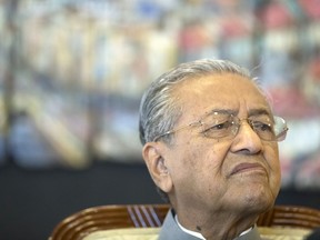 Malaysian Prime Minister Mahathir Mohamad listens to questions during an interview with foreign media on one years anniversary of government in Putrajaya, Malaysia, Thursday, May 9, 2019. Mahathir reiterates that he is an interim prime minister and will stick to his promise to hand over to his successor Anwar Ibrahim.