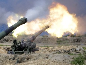 M110 self-propelled Howitzers fire during the annual Han Kuang exercises in Pingtung County, Southern Taiwan, Thursday, May 30, 2019.