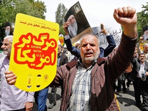 Iranian demonstrators chant anti-U.S. slogans during a rally in the capital Tehran, on May 10 2019.