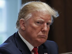 U.S. President Donald Trump listens during a working lunch with governors on workforce freedom and mobility in the Cabinet Room of the White House in Washington, D.C., U.S., on Thursday, June 13, 2019.