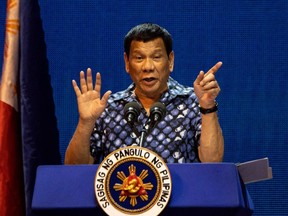 Philippine President Rodrigo Duterte gestures during the Partido Demokratiko Pilipino-LakasBayan (PDP-LABAN) meeting in Manila on May 11, 2019.