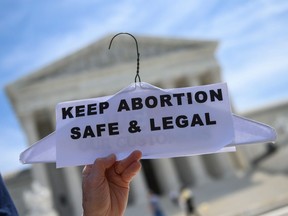 In this file photo taken on May 21, 2019 Abortion rights activists rally in front of the US Supreme Court in Washington, DC.