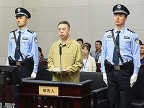 This handout photo taken on June 20, 2019 and released by the Tianjin No.1 Intermediate Court shows former Interpol chief Meng Hongwei (C) during his trial at the court in Tianjin, northern China.