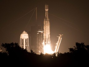 This SpaceX photo released by NASA shows the SpaceX Falcon Heavy rocket carrying 24 satellites as part of the Department of Defence's Space Test Program-2 (STP-2) mission launching from Launch Complex 39A on June 25, 2019 at NASA's Kennedy Space Center in Florida.