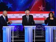 In this file photo taken on June 27, 2019, U.S. Senator for California Kamala Harris (R) speaks alongside former U.S. Vice President Joseph R. Biden Jr. (L) and U.S. Senator for Vermont Bernie Sanders during the second Democratic primary debate of the 2020 presidential campaign season hosted by NBC News at the Adrienne Arsht Center for the Performing Arts in Miami, Florida.