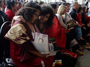 Attendees console each other at the closing ceremony for the National Inquiry into Missing and Murdered Indigenous Women and Girls in Gatineau, Que., on Monday, June 3, 2019.