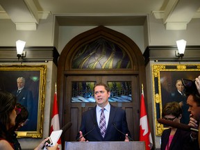 Conservative Leader Andrew Scheer talks to the media in the foyer of the House of Commons on Parliament Hill, in Ottawa on June 10, 2019.