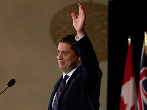 Conservative Leader Andrew Scheer waves to the audience during a speech at The Royal Glenora Club in Edmonton on June 4, 2019.