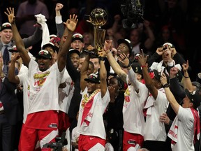 Toronto Raptors guard Kyle Lowry (right) celebrates with the Larry O'Brien Championship Trophy after defeating the Golden State Warriors for the NBA Championship in game six of the 2019 NBA Finals.