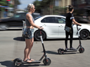 People ride Bird electric scooters in Santa Monica, California. The company has scooters in 120 markets around the world.