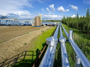 Pipes carry recovered bitumen from Devon Energy Corp.'s Jackfish Projects processing plant near Conklin, Alta., in a file photo from June 28, 2010.