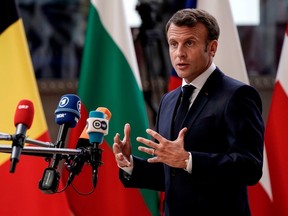 France's President Emmanuel Macron speaks to the press as he arrives for an European Council Summit at The Europa Building in Brussels, on June 30, 2019.