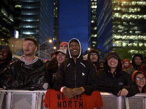 Raptors fans react outside of Scotiabank Arena during Game 5 of the NBA Final between Toronto Raptors and Golden State Warriors in Toronto Monday, June 10, 2019.