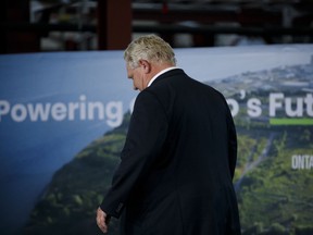 Ontario Premier Doug Ford leaves the stage following an announcement in the the mock-up facility at the Darlington Power Complex, in Bowmanville, Ont., Friday, May 31, 2019.