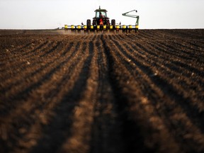 A crop farmer plants corn for the first time of the season in 2011.
