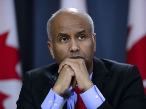 Minister of Immigration, Refugees and Citizenship Ahmed Hussen pauses in Ottawa on Tuesday, May 7, 2019. Immigration Minister Ahmed Hussen says he is concerned by numbers in a new poll that suggest a majority of Canadians believe the government should limit the number of immigrants it accepts since the country might be reaching a limit to its ability to integrate them.THE CANADIAN PRESS/Sean Kilpatrick