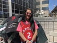 Angie Taylor, 33, from Cambridge, Ont., lines up at Jurassic Park by Scotiabank Arena in Toronto, Saturday, June 8, 2019. Die-hard Toronto Raptors fans are lining up days in advance for a spot in the outdoor fanzone known as Jurassic Park for Game 5 of the NBA Finals on Monday night.