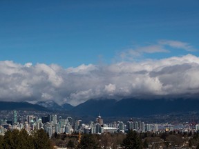 Condo and office towers fill the downtown skyline in Vancouver on Friday, March 30, 2018. Vancouver city council has voted in favour of a motion that demands global fossil fuel companies pay their share of costs arising from climate change.