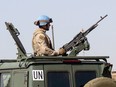 A Canadian Armed Forces soldier provides security as Canadian Prime Minister Justin Trudeau arrives on the United Nations in Gao, Mali, Saturday December 22, 2018. The military's peacekeeping mission in Mali is going to last a little longer than previously planned ???but not as long as the United Nations hoped.