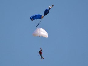 Witnesses say a Toronto man who was injured in a skydiving mishap during a D-Day commemoration in Hamilton is lucky to be alive.
