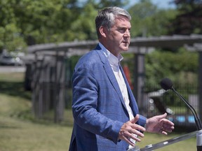 Nova Scotia Premier Stephen McNeil talks with reporters as the Canadian premiers meet in St. Andrews, N.B. on Thursday, July 19, 2018. A Cape Breton high school has decided to stop calling its hockey team the Redmen, the latest to drop the name after McGill University in Montreal did so earlier this year.