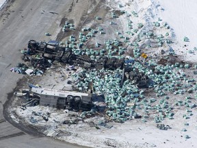 The wreckage of a fatal crash involving the team bus for the the Humboldt Broncos hockey team outside of Tisdale, Sask., is seen Saturday, April, 7, 2018. Transport Canada says they will soon require all commercial drivers to have electronic logging devices. The federal department says they will make the tamper-resistant devices mandatory on June 12, 2021, to ensure truck and bus drivers are not on the road for longer than their daily limit. It also addresses one of the Saskatchewan Coroner's Service recommendations after the Humboldt Broncos bus crash in April 2018.