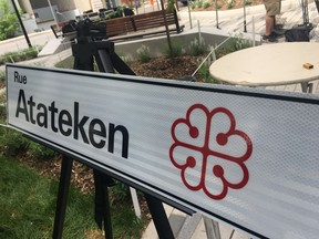 A Montreal street named after the British general Jeffery Amherst is being renamed Atateken Street in honour of the local Indigenous population. A new street sign showing the renamed Rue Atateken is seen during a press conference in Montreal on Friday, June 21, 2019. Atateken is a Mohawk word that means brotherhood and sisterhood.