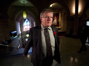 Conservative Sen. Don Plett arrives at the Senate on Parliament Hill in Ottawa on Monday, October 28, 2013.