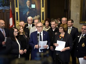 Liberal MP Neil Ellis is joined by Conservative MP Cathay Wagantall, left, NDP MP Sheri Benson, second from right, and members of advocacy groups during a press conference on his motion M-225, which calls on the federal government to set a goal of ending veteran homelessness with a plan and deadlines, in the Foyer of the House of Commons on Parliament Hill in Ottawa on Wednesday, June 5, 2019. The House of Commons has officially backed a backbench MP's bid to have the government work to end veterans homelessness after days of partisan bickering over the fate of the private motion.