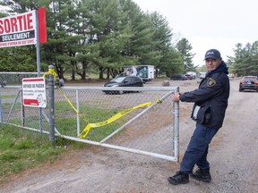 A Society for the Prevention of Cruelty to Animals officer closes the gate where the owner of the zoo was arrested on charges of cruelty to animals in St-Edouard-de-Maskinonge, Que. on May 21, 2019. Newly unsealed court documents show investigators who visited a small Quebec zoo at the heart of an animal cruelty investigation found animals that were malnourished and lacked water and veterinary care. The documents, which were filed in May in order to obtain a warrant, included veterinary reports on the animals and the conditions observed at the St-Edouard Zoo during two visits by the SPCA in 2018.